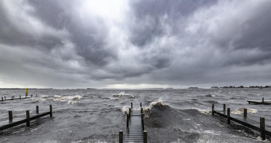 Storm surge waters flooding docks along the coast. iStock