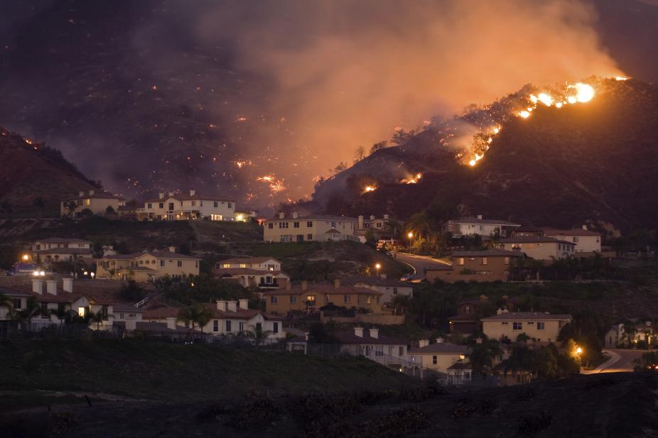 Wildfire quickly approaching homes. Taken during the Santiago fire, October 23 in California. iStock